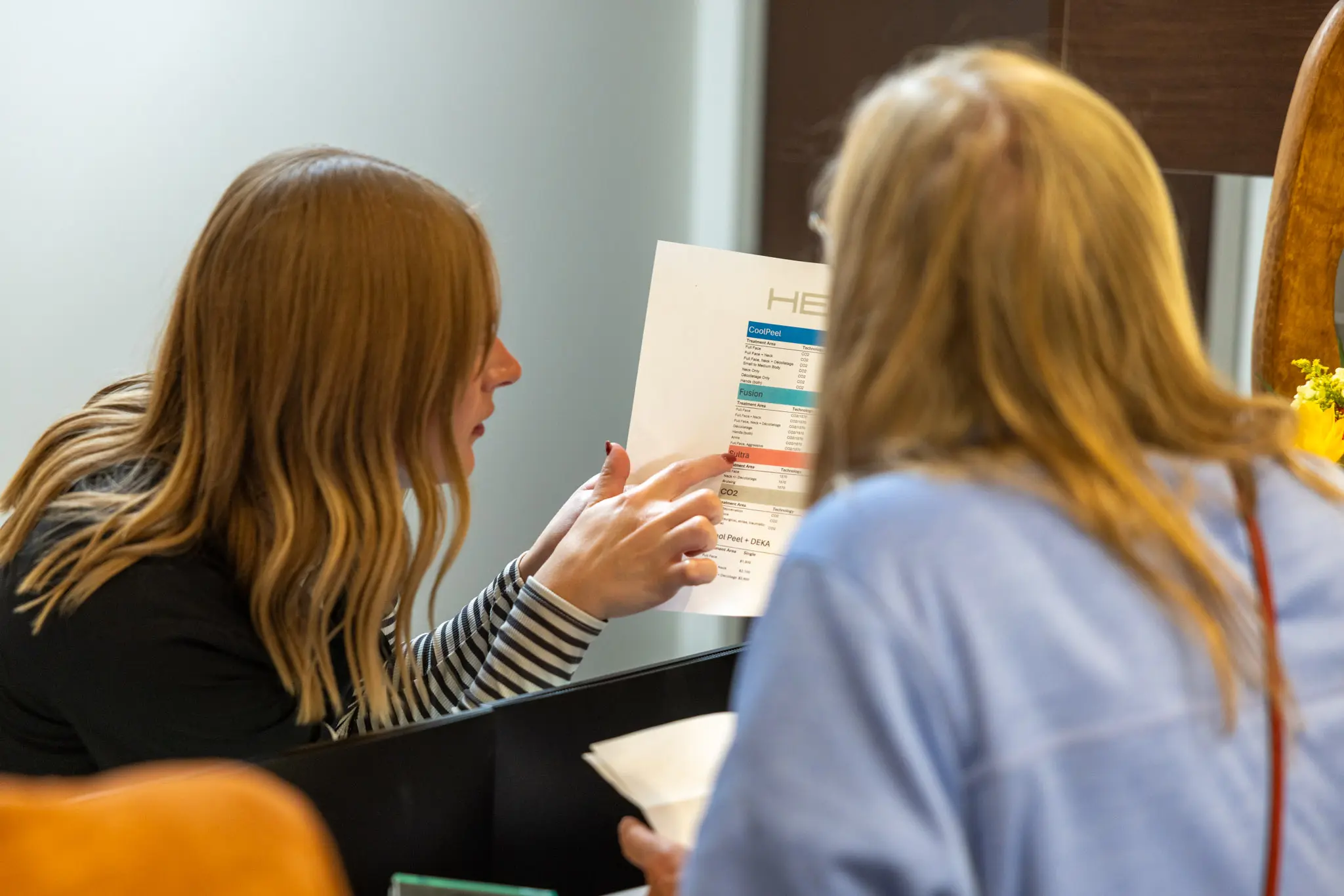 IRIS Aesthetics provider helping a customer pick the right aesthetic services