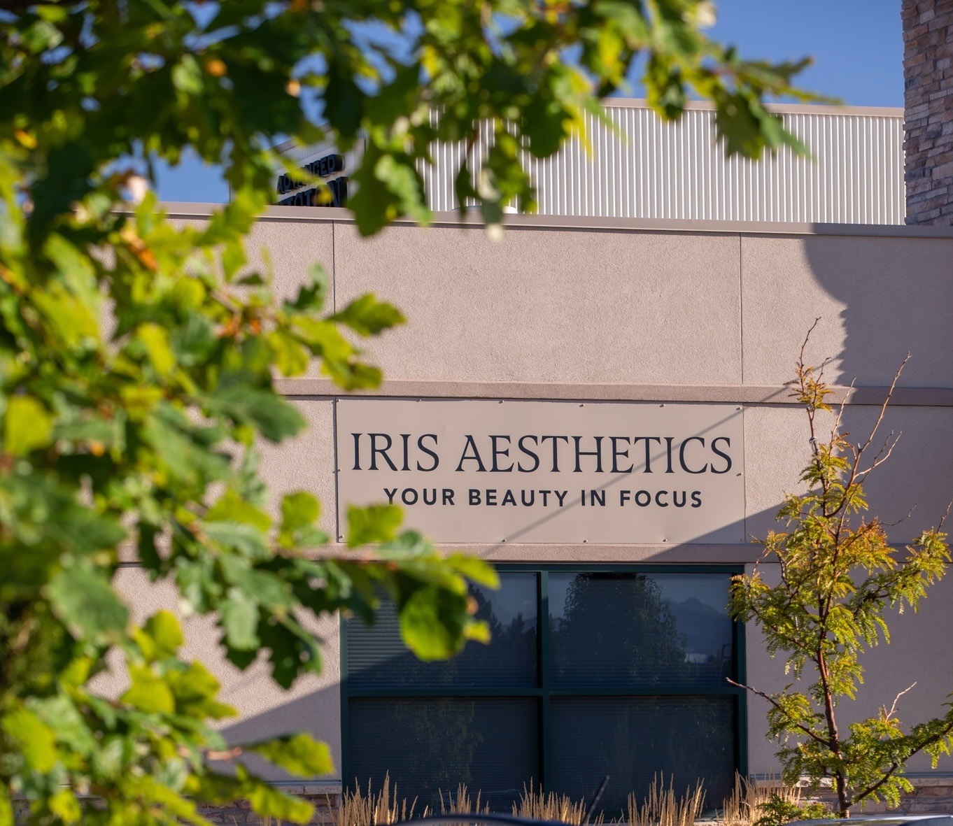 IRIS Aesthetics front building entrance with sign in Longmont, CO
