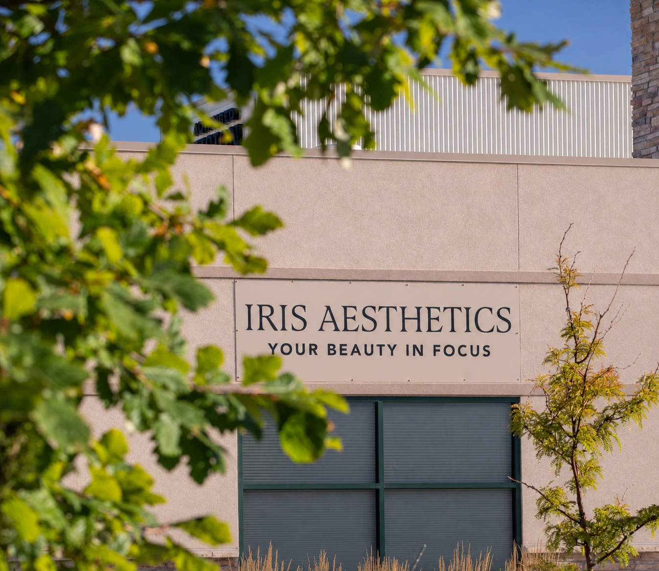 IRIS Aesthetics signage on the front of the Longmont, CO medical spa building